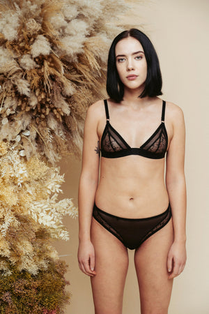 Model shot from the front, wearing the Kauf Brazilian Knicker and Triangle Bralette in black